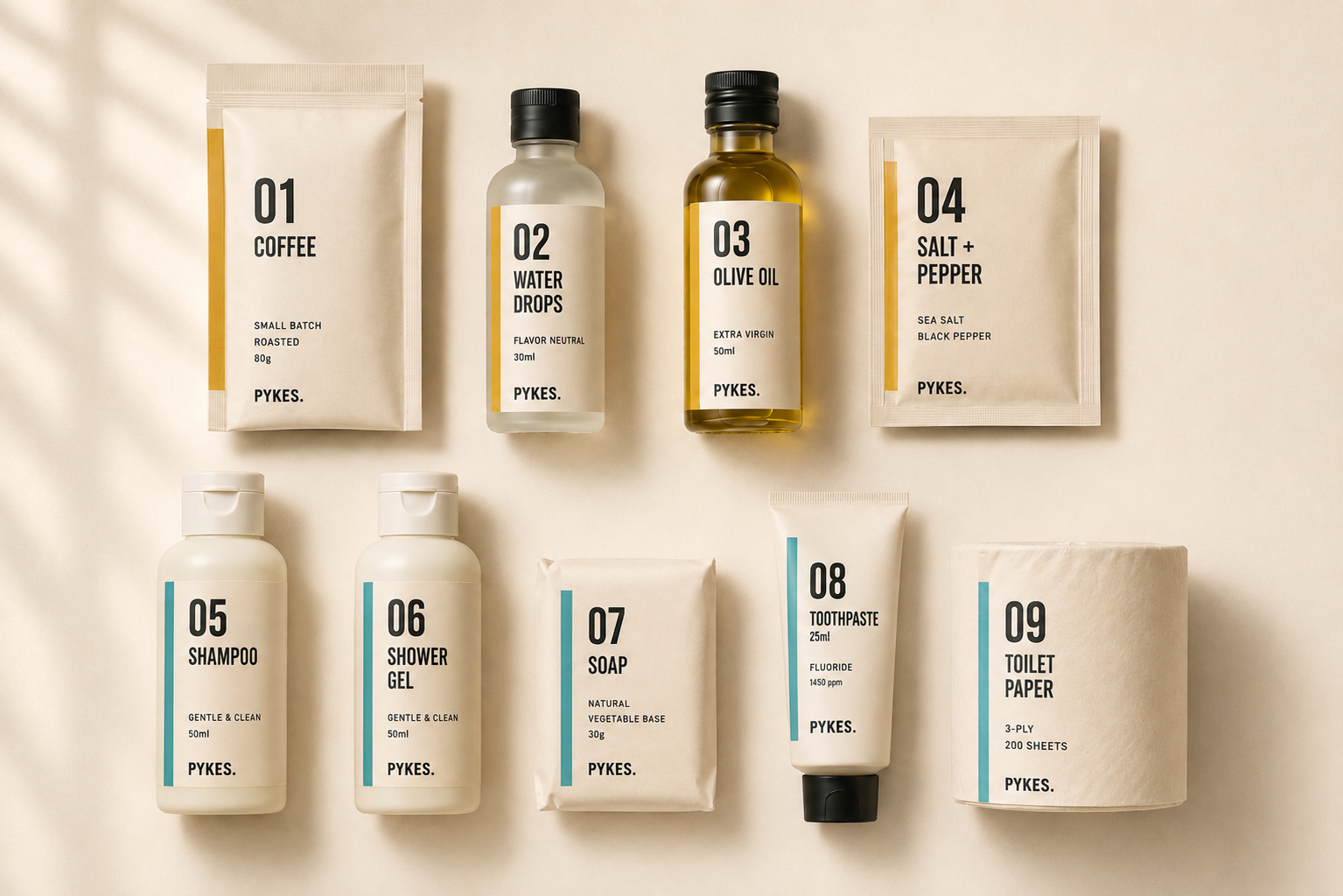 Flat lay of all nine PYKES products on cream